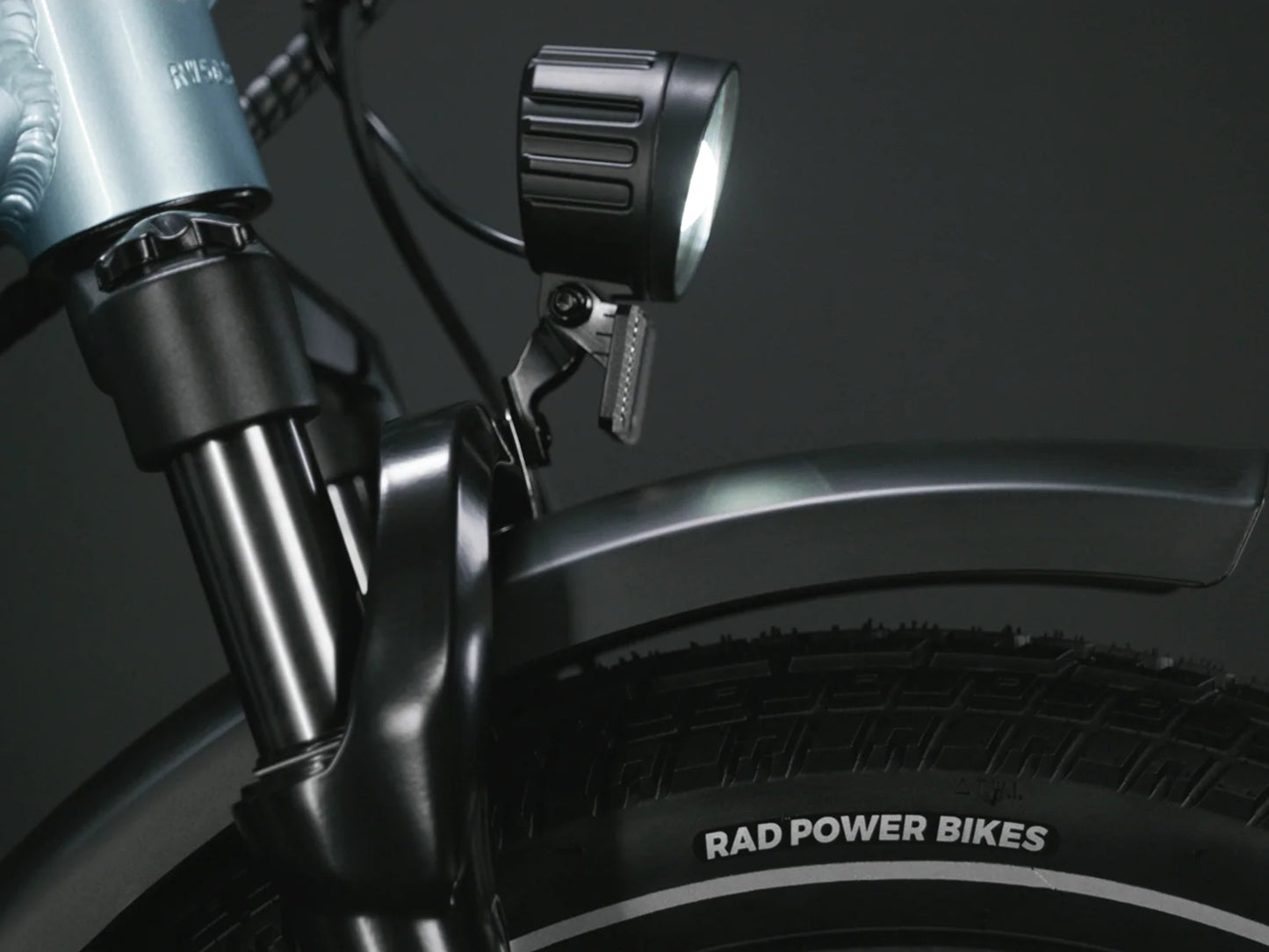 Rad Power RadWagon 5 Electric Cargo bike Metalllic blue Headlight, front fender closeup