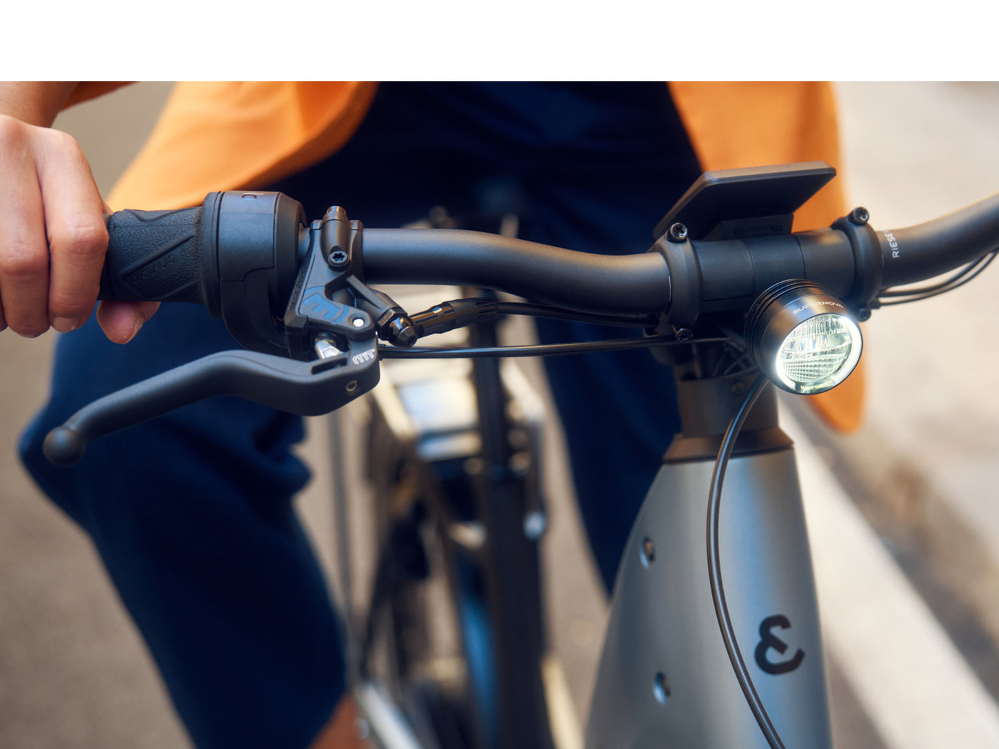 Riese & Muller Nevo5 Automatic Leisure Road / Commuter Lifestyle closeup of headlight, handlebars, shifters