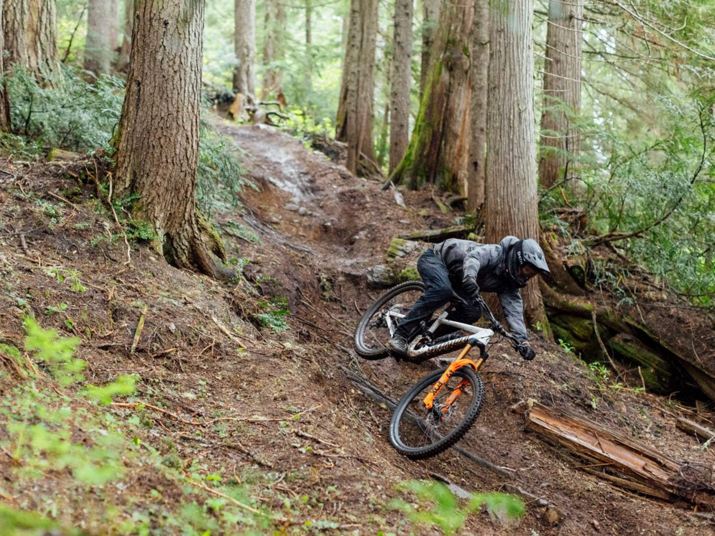 Specialized Enduro Full Suspension Mountain bike Downhill rider on dirt path in a forest setting