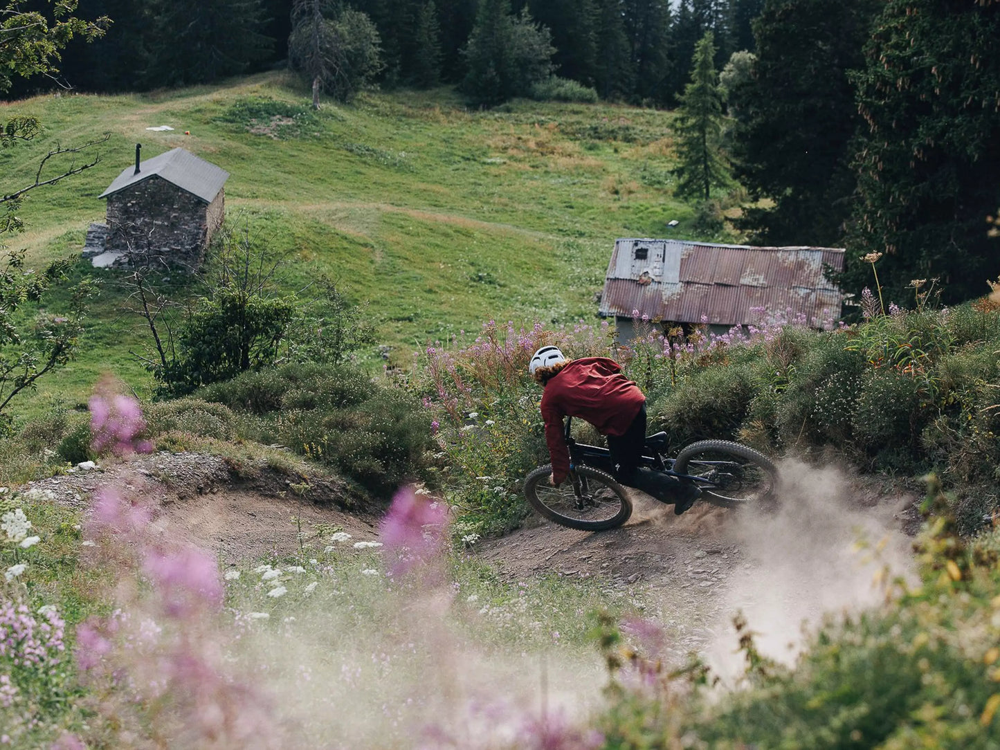 Specialized Turbo Levo Pro Carbon Full Suspension eMTB Rider downhill on grassy mountainside
