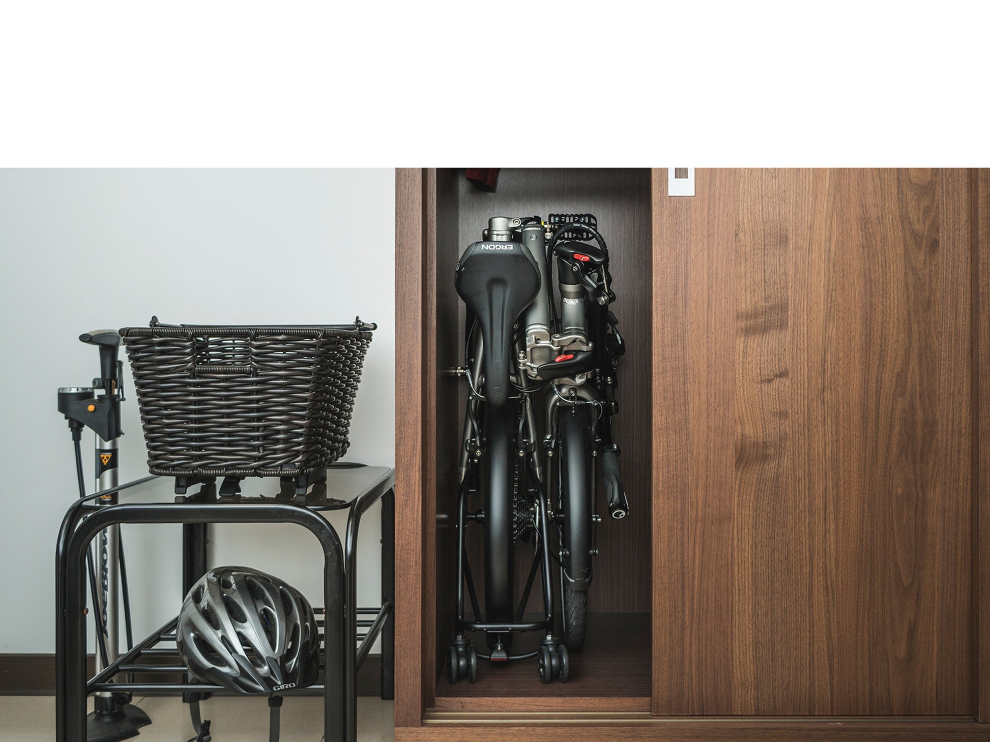 Tern BYB P10 Ultra compact folding bike Matte Beetle blue Shown folded and stored in closet