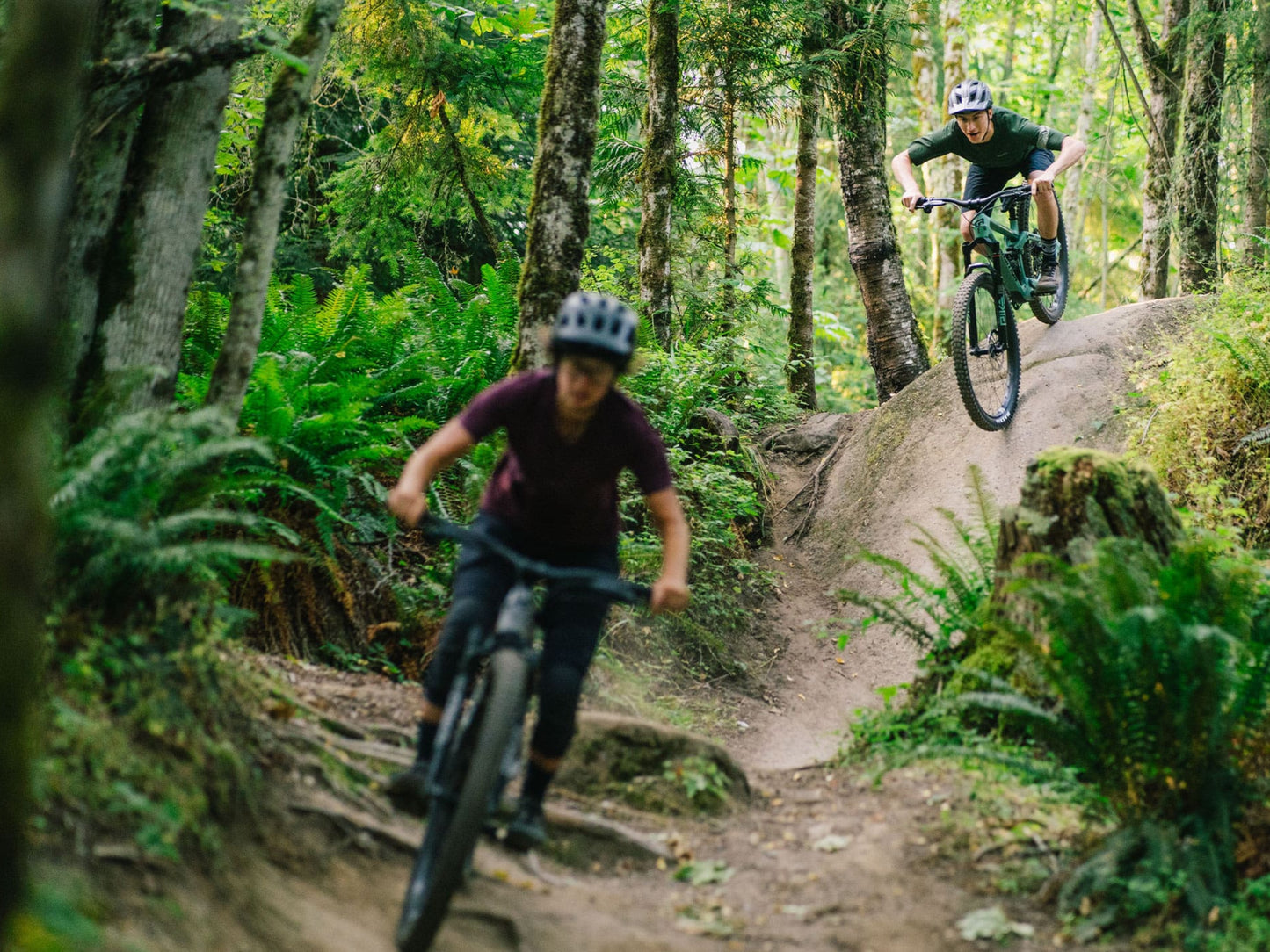 Transition Smuggler Full suspension Mountain bike. Lifestyle, Riders going downhill on dirt path in forest