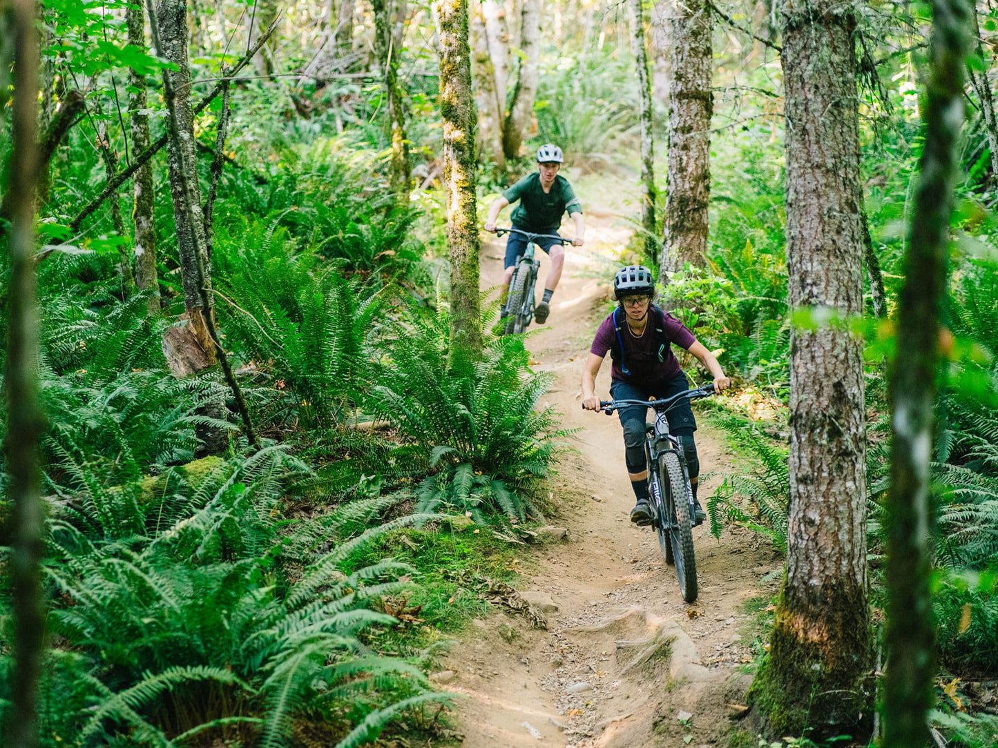 Transition Smuggler Full suspension Mountain bike. Lifestyle, Riders on dirt path in forest