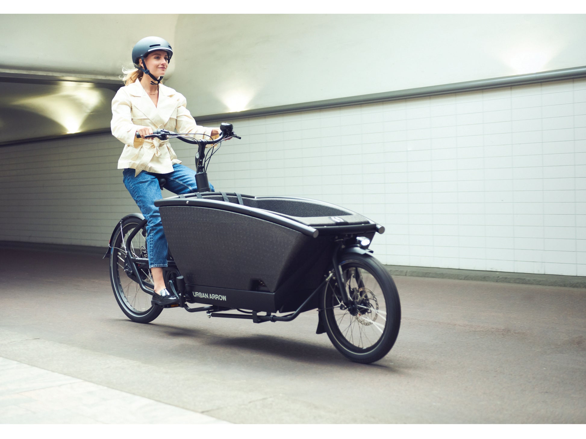 Urban Arrow Family Cargo electric bike lady commuting in city