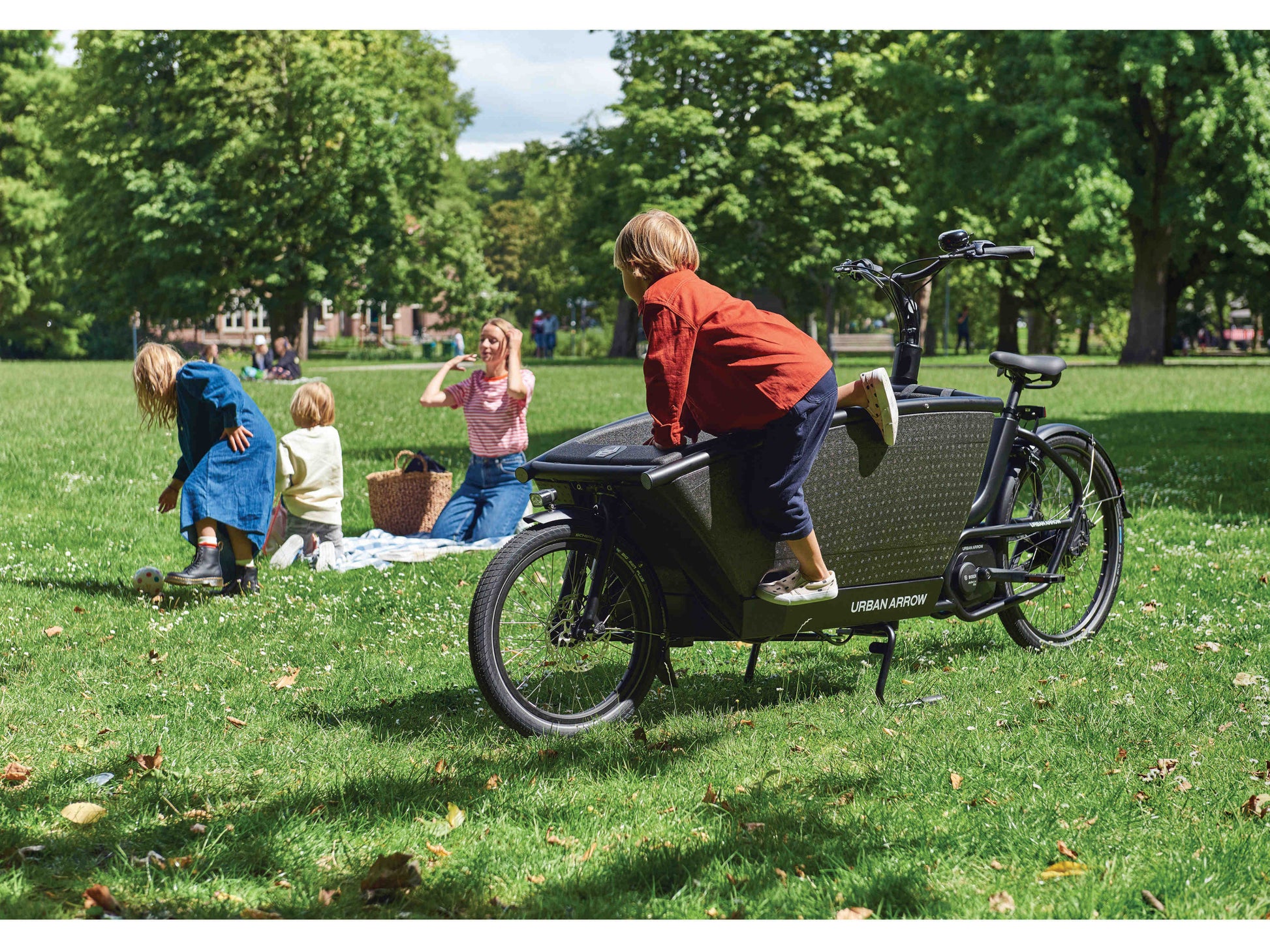 Urban Arrow Family Performance cargo electric bike family picnic in park