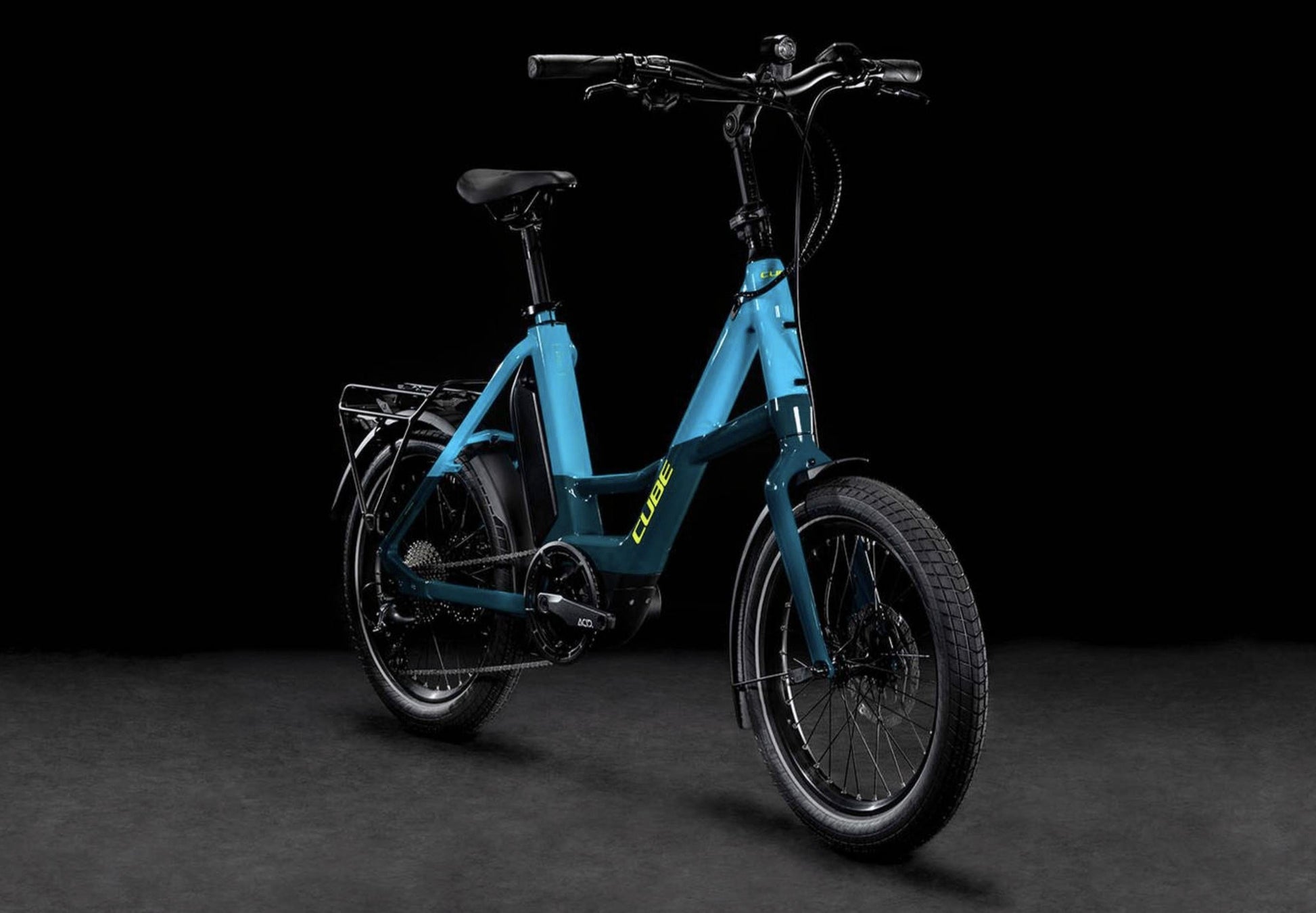 Cube Compact Sport Hybrid 500 eBike Blue and Lime front quarterview on black background on Fly Rides