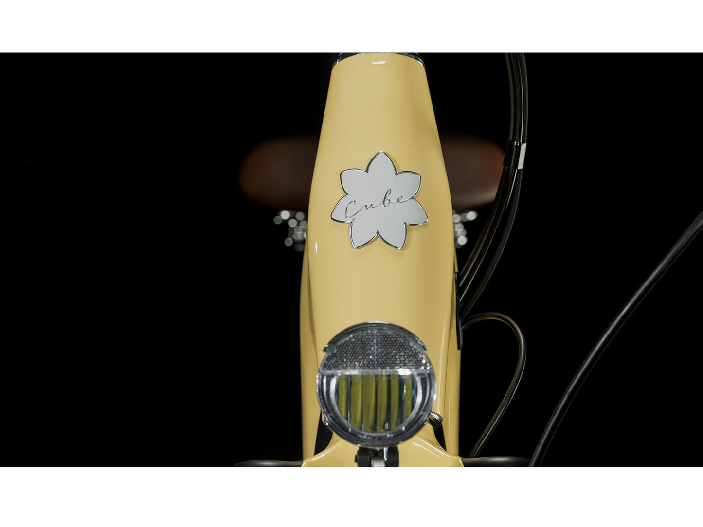 Cube Ella Ride Hybrid 500 eMTB hardtail closeup honey n white Trelock Bike i Retro front light headset
