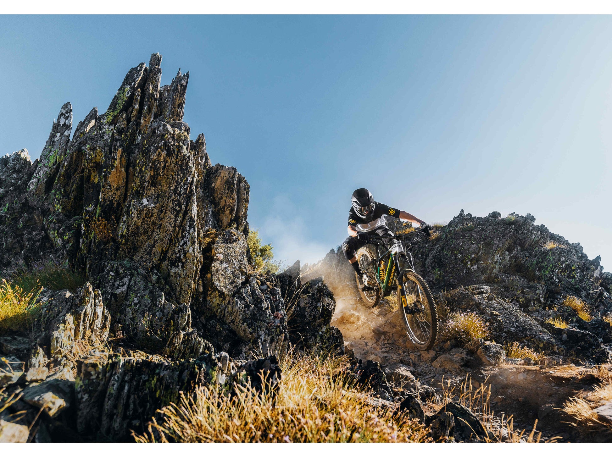 Mondraker Level XR eMTB full suspension  riding down steep rocky trail