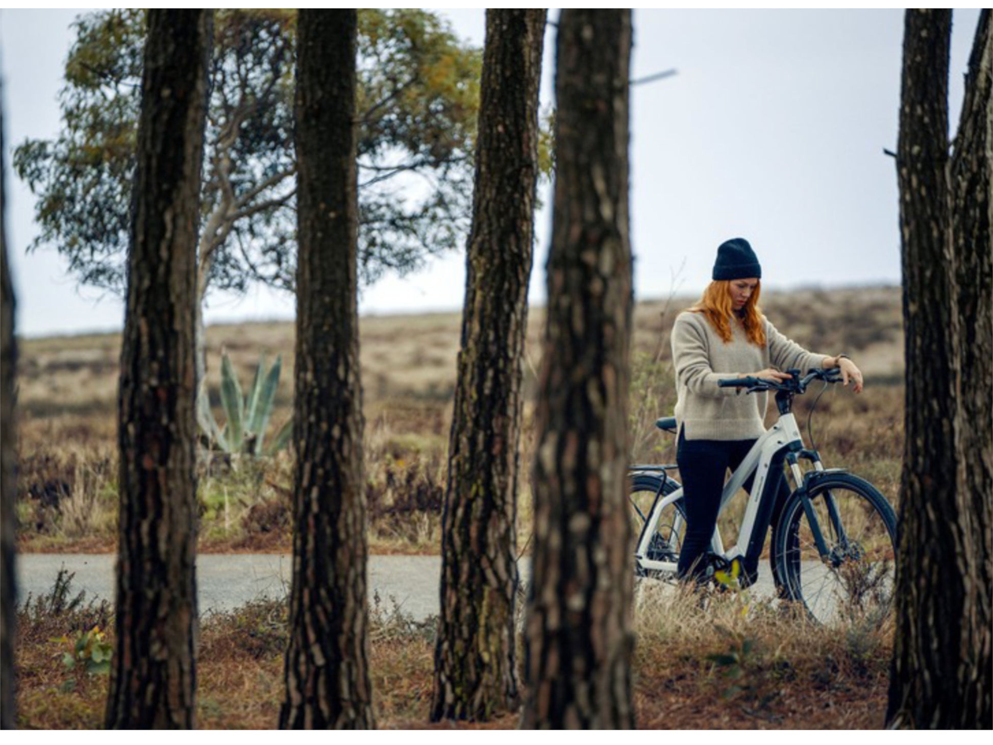 Riese and Muller Charger3 Mixte Vario HS emtb hardtail woman on country road checking display