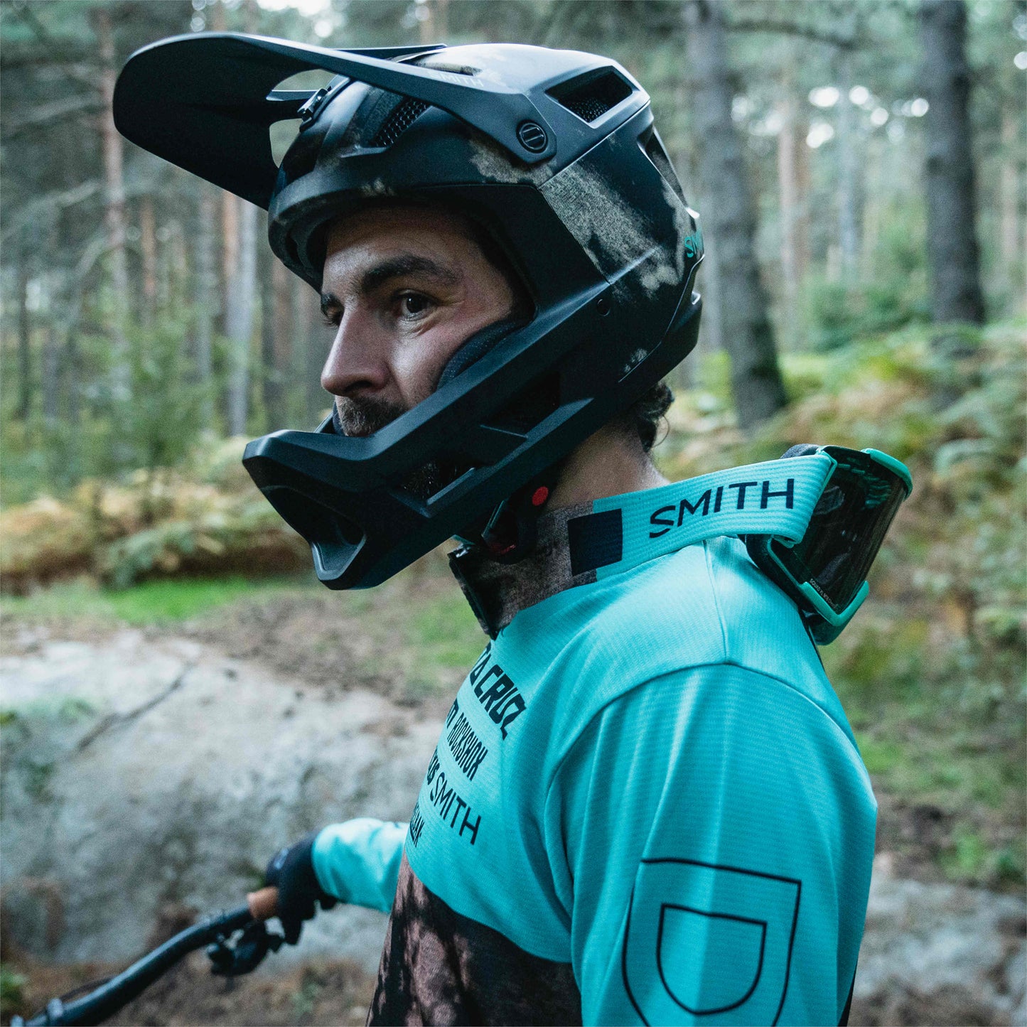 Smith Optics Mainline MIPS MTB Enduro Helmet rider wearing helmet on forest trail