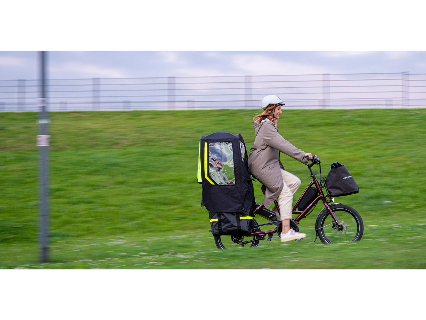 Tern Quick Haul D8 electric cargo bike woman and child riding on city bike path
